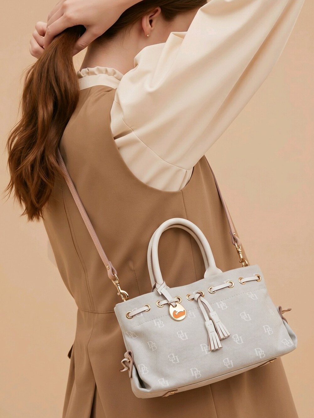 Dooney & Bourke Cream Satchel with Gold Accents